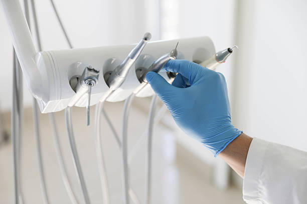 Professional Tooth Extraction technician working in Tattnall County County, GA